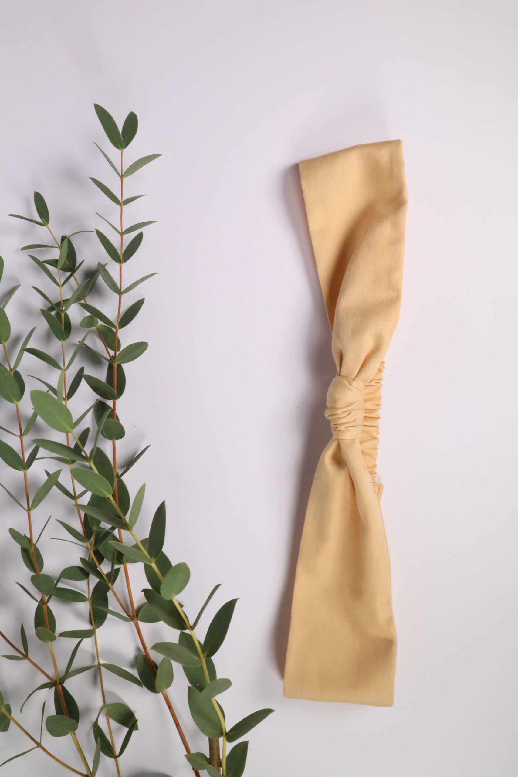 Haarband, Stirnband, schmal, Haare, Haaraccessoires, Accessoires, Frisur, Turban, Masche, Mascherl, Knoten, Knopf, Schleife, Trend, modern, pfirsich, orange, apricot, aprikose